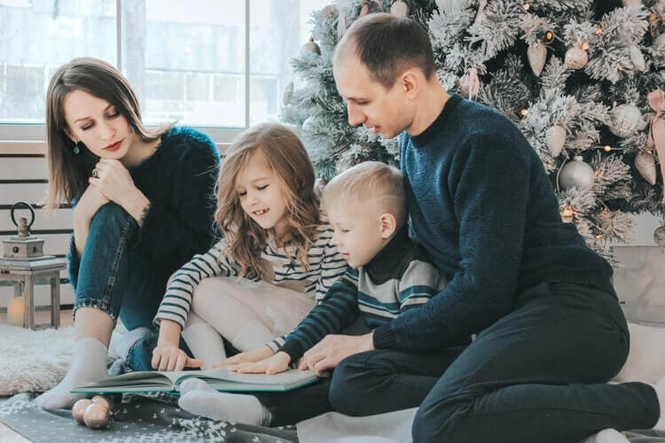 family reading a book together