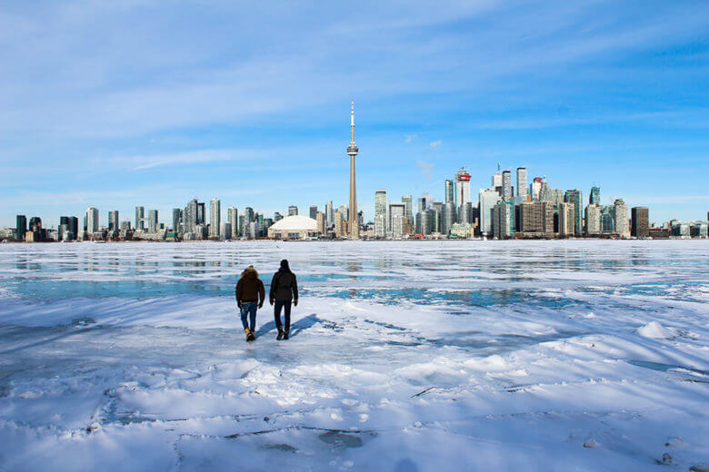 people walking on a frozen river