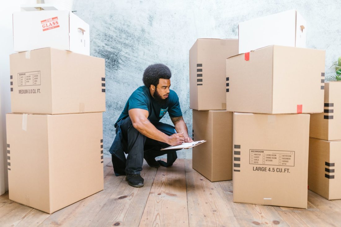 professional mover packing the boxes