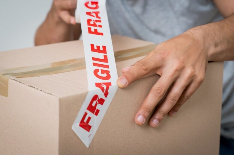 Movers labeling boxes