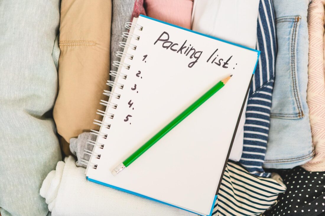 To-Do list on the top of packed clothes