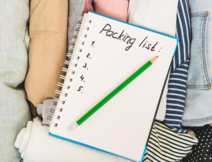 To-Do list on the top of packed clothes