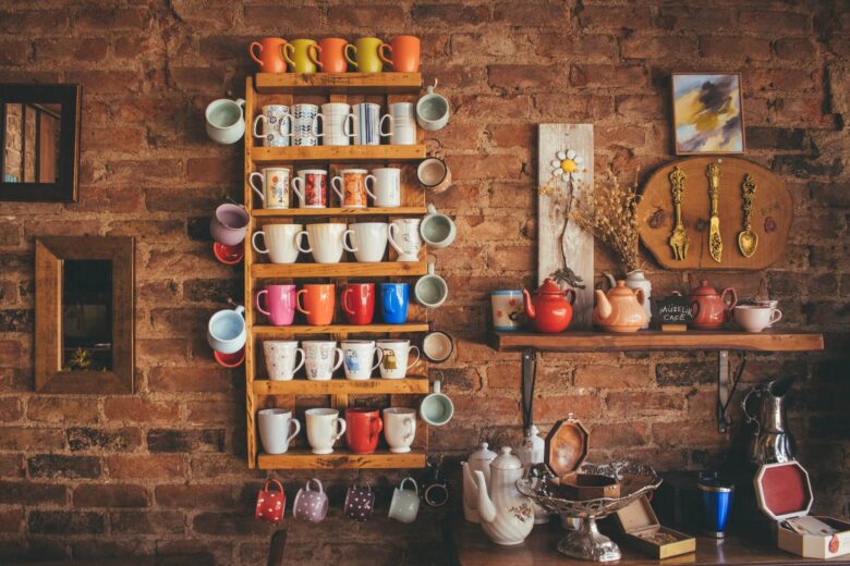 Colorful mugs on a shelf