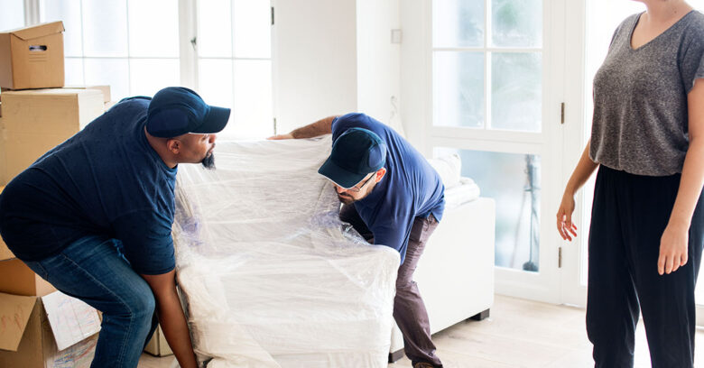 Movers carrying sofa