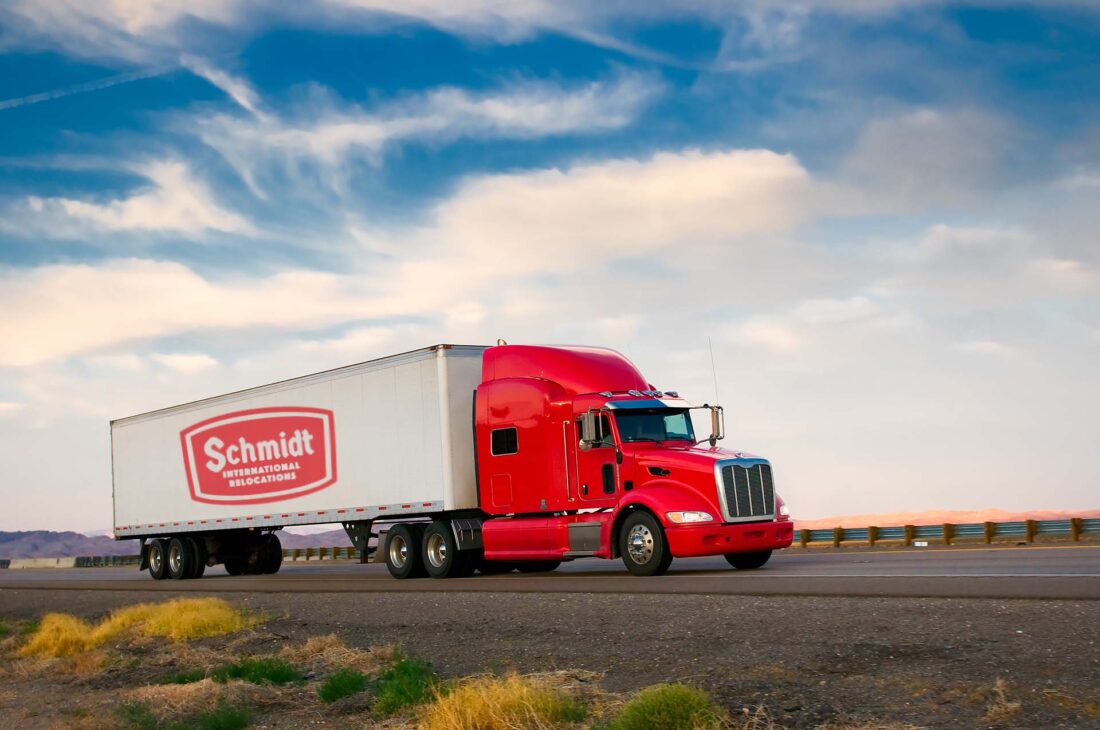 Red truck moving on a highway