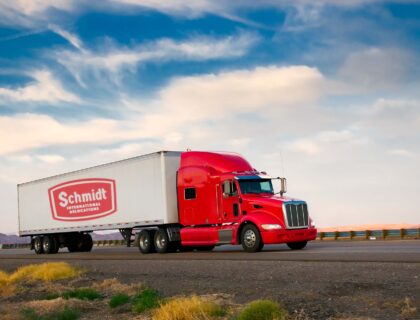 Red truck moving on a highway