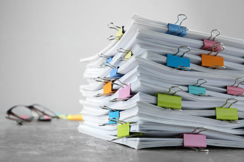 Stack of documents with colored clips