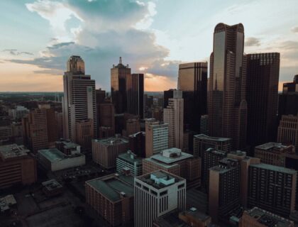 Aerial sunset view of downtown Dallas with illuminated skyscrapers and vibrant city skyline, TexasTX