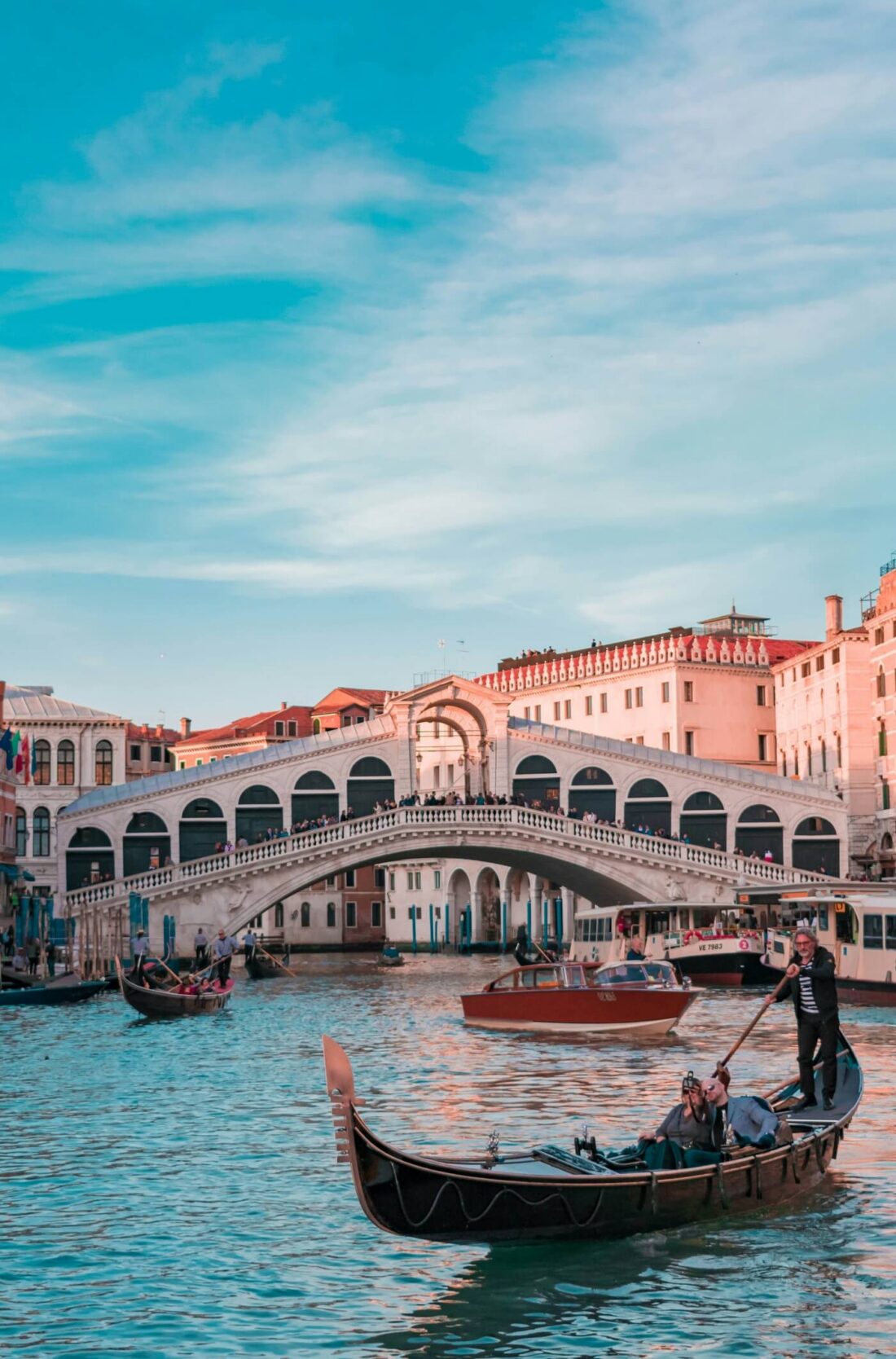 Historic Rialto Bridge spanning the Grand Canal in Venice Italy.